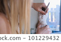 a female sculptor creates a sculptural bust of a clay human woma 101229432