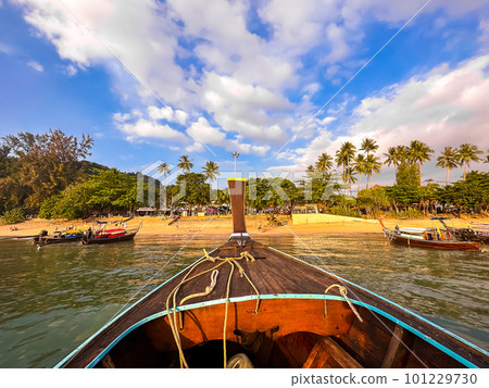 Long tail boats at sunset in Railay beach in Krabi, Thailand Long tail boats at sunset in Railay beach in Krabi, Thailand 101229730