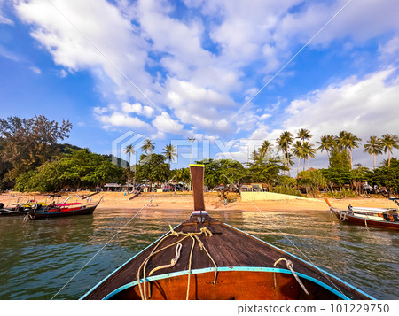 Long tail boats at sunset in Railay beach in Krabi, Thailand Long tail boats at sunset in Railay beach in Krabi, Thailand 101229750