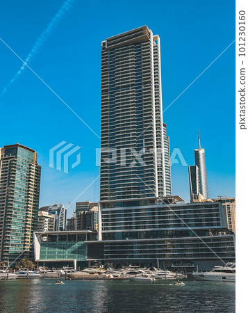 Dubai Marina, harbour, cruise boat and canal promenade view at sunset, in Dubai, United Arab Dubai Marina, harbour, cruise boat and canal promenade view at sunset, in Dubai, United Arab 101230160