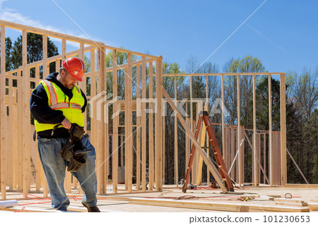 Worker are building of framing new wooden house Worker are building of framing new wooden house 101230653