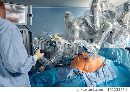 Surgical system with minimally invasive robot in a hospital. Robotic technological equipment, manipulator surgeon in a futuristic operating room. Medical innovation 3D endoscopy for robotic surgery in 101233334