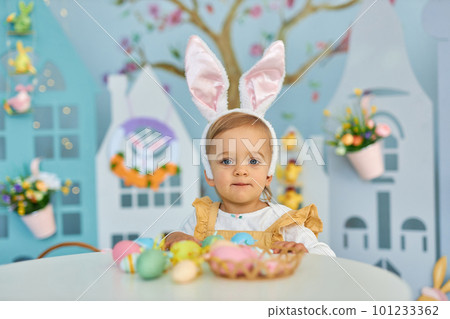 Funny cute girl in bunny ears celebrating Easter Funny cute girl in bunny ears celebrating Easter 101233362