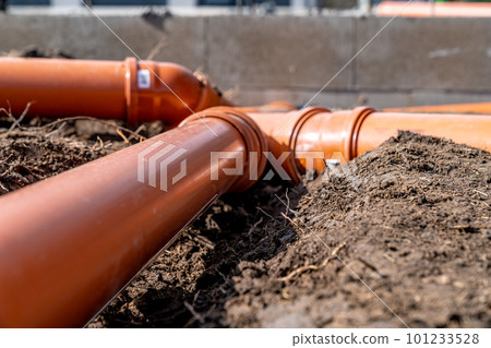 sewage system made of plastic PVC pipes in the ground sewage system made of plastic PVC pipes in the ground 101233528