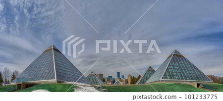 Edmonton, Alberta. Mar 30, 2023. Panoramic view of The Muttart Conservatory, Botanical gardens glass pyramids with tropical and arid biomes. 101233775