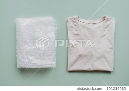 Recycle clothes concept. Recycling Fibers in the Textile Industry. Sustainable recycled cotton fiber. Recycled cloth T-shirt and bubble wrap plastic 101234983