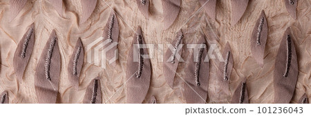 Fashion cloth decorated with fabric leaves texture background Fashion cloth decorated with fabric leaves texture background 101236043
