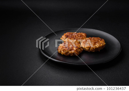 Delicious fresh fried minced fish cutlets with spices and herbs 101236437