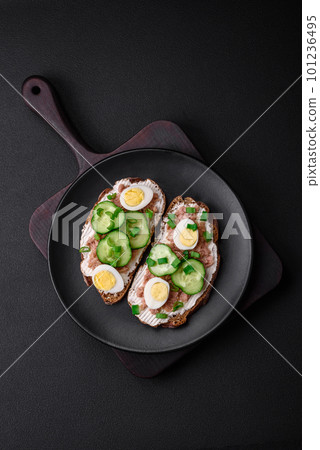 Delicious sandwiches consisting of grilled toast, canned tuna, cream cheese 101236495