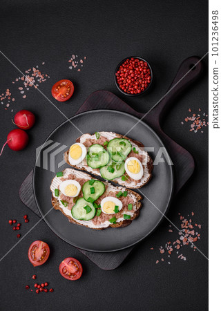 Delicious sandwiches consisting of grilled toast, canned tuna, cream cheese 101236498