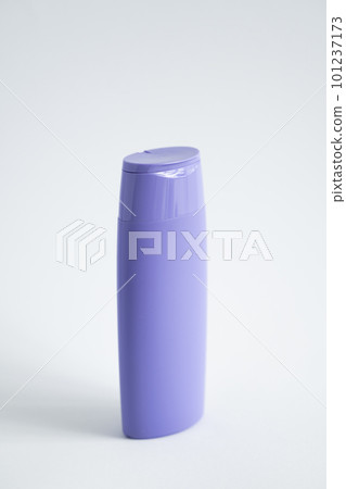 Violet plastic bottle of body care and beauty products. Studio photography of plastic bottle for shampoo, shower gel, creme isolated on white background. Violet plastic bottle of body care and beauty products. Studio photography of plastic bottle for shampoo, shower gel, creme isolated on white background. 101237173