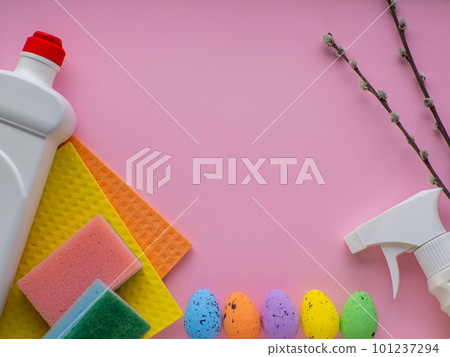 Detergent with Easter decoration on pink background with copy space 101237294