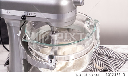 Step by step. Mixing ingredients in kitchen mixer to bake homemade brioche buns. 101238243