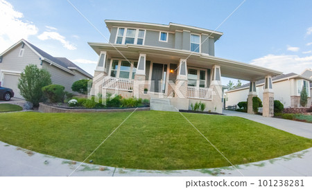 View of the typical suburban neighborhood on a summer morning. 101238281