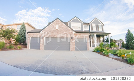 View of the typical suburban neighborhood on a summer morning. View of the typical suburban neighborhood on a summer morning. 101238283