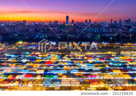 Sunset over Bangkok, Thailand, and colorful night market.  101238810