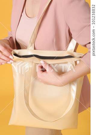 faux leather white shopper bag close up photo with model hand and face faux leather white shopper bag close up photo with model hand and face 101238832