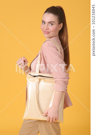 faux leather white shopper bag close up photo with model hand and face faux leather white shopper bag close up photo with model hand and face 101238845