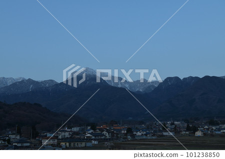 Mt. Kaikomagatake standing in the blue hour in Hakushu-cho, Hokuto City and the townscape of Rokuhakushu 101238850