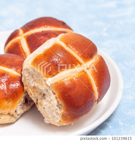 Freshly baked hot cross buns on white plate. Traditional easter food, square Freshly baked hot cross buns on white plate. Traditional easter food, square 101239615