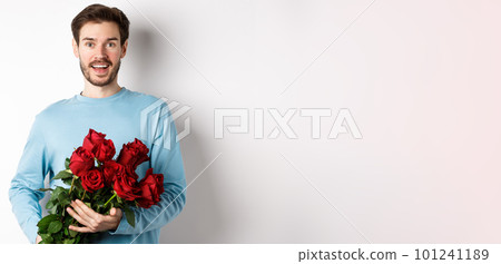 Romantic boyfriend bring beautiful bouquet of red roses on valentines day, having date with girlfriend, saying I love you, standing passionate on white background Romantic boyfriend bring beautiful bouquet of red roses on valentines day, having date with girlfriend, saying I love you, standing passionate on white background 101241189