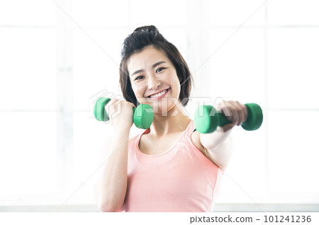 smiling woman with dumbbells smiling woman with dumbbells 101241236
