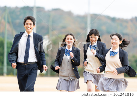 A high school girl and a male teacher running on the ground 101241816