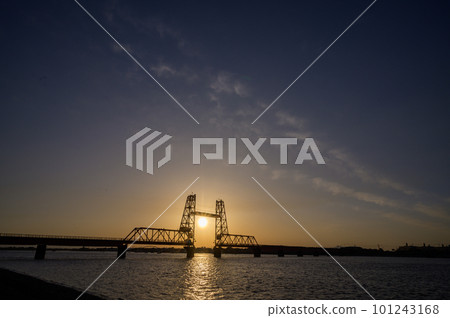 The setting sun over the Chikugo River lift bridge The setting sun over the Chikugo River lift bridge 101243168