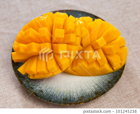 Deliciously served fresh mangoes diced and laid out on plate Deliciously served fresh mangoes diced and laid out on plate 101245238