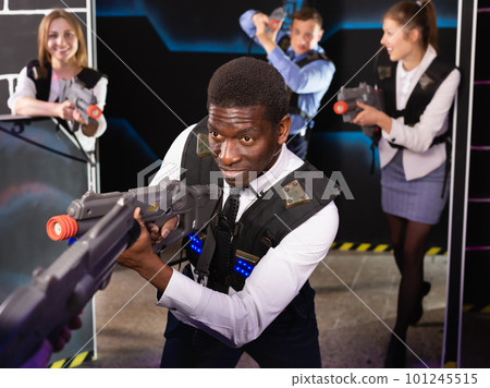 African American with laser gun playing laser tag 101245515