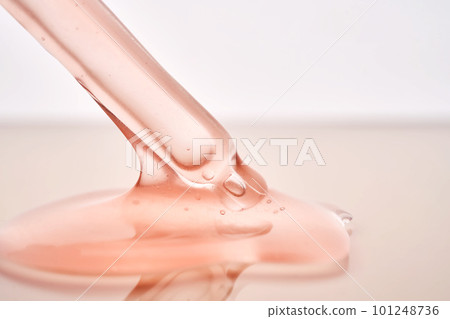 Pipette with a viscous pink cosmetic close-up. Pipette with a viscous pink cosmetic close-up. 101248736