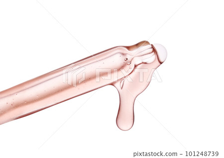 Pipette with a viscous pink cosmetic close-up. 101248739