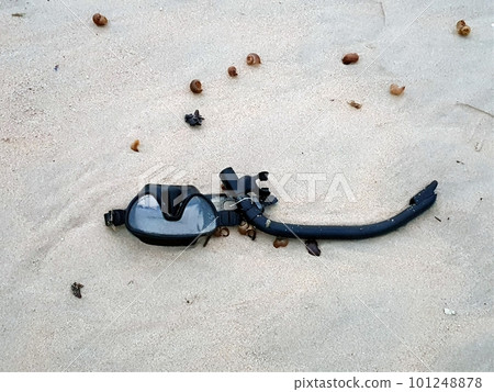 snorkeling glasses on the sand in beach 101248878
