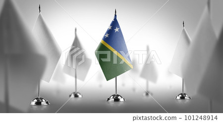 The national flag of the Solomon surrounded by white flags The national flag of the Solomon surrounded by white flags 101248914