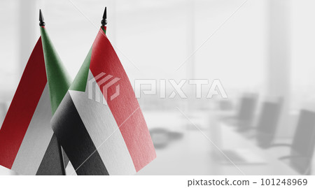 Small flags of the Sudan on an abstract blurry background Small flags of the Sudan on an abstract blurry background 101248969