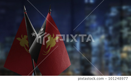 Small flags of the Papua New Guinea on an abstract blurry background Small flags of the Papua New Guinea on an abstract blurry background 101248977