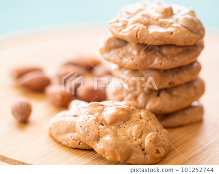 Croquettes and almonds on a cutting board Croquettes and almonds on a cutting board 101252744