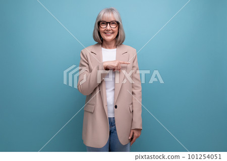 60s middle-aged woman in a stylish laconic jacket on a studio background with copy space 60s middle-aged woman in a stylish laconic jacket on a studio background with copy space 101254051