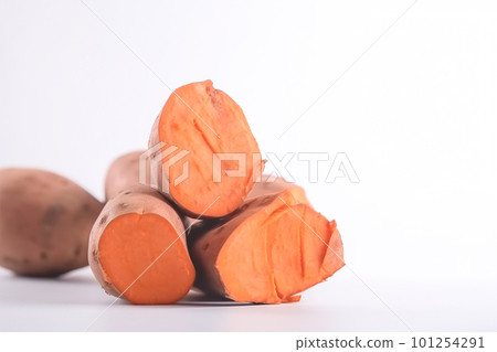 Close up of sweet potatoes on white background with copy space. Healthy vegan vegetarian food concept 101254291