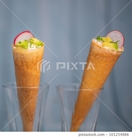 Brick cone with tuna sauce, mayonnaise, avocado and radish slice 101254866