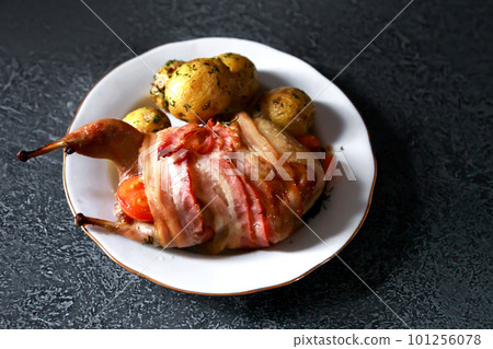 Close up of grilled quails carcasses on black 101256078