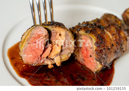 Pigeon meat and foie gras wrapped in cabbage Pigeon meat and foie gras wrapped in cabbage 101259135