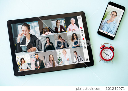 Meeting time. Online event. Morning briefing. Corporate chat. Business team working on tablet phone gadget screen with alarm clock on blue. Meeting time. Online event. Morning briefing. Corporate chat. Business team working on tablet phone gadget screen with alarm clock on blue. 101259971
