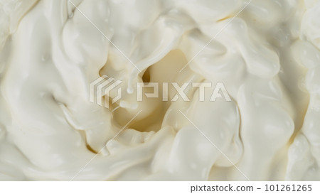 Freeze motion of whirling milk cream, close-up 101261265