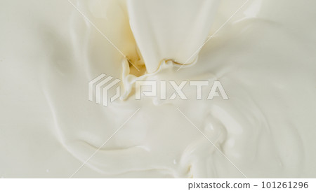 Freeze motion of whirling milk cream, close-up 101261296