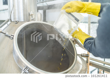dried granulated hops in the brewery when brewing beer. added to a stainless steel tank when brewing beer dried granulated hops in the brewery when brewing beer. added to a stainless steel tank when brewing beer 101261411
