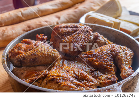 Hot Fried Chicken tobacco in a pan close-up 101262742