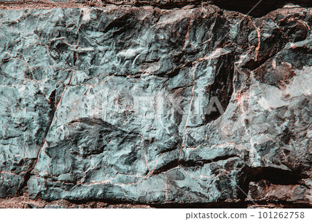 Stone texture of an old rough building wall with cracks, reliefs, plots. Random pattern 101262758