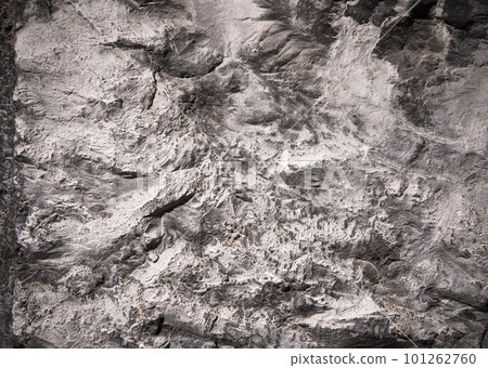 Stone texture of an old rough building wall with cracks, reliefs, plots. Random pattern Stone texture of an old rough building wall with cracks, reliefs, plots. Random pattern 101262760