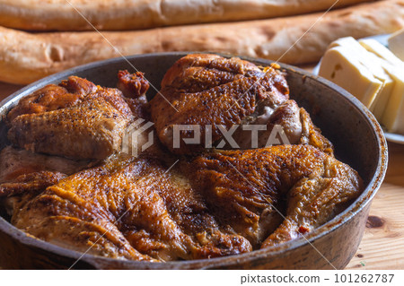 Hot Fried Chicken tobacco in a pan close-up 101262787
